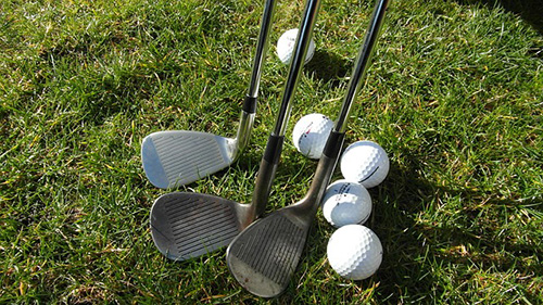 golf clubs and balls
